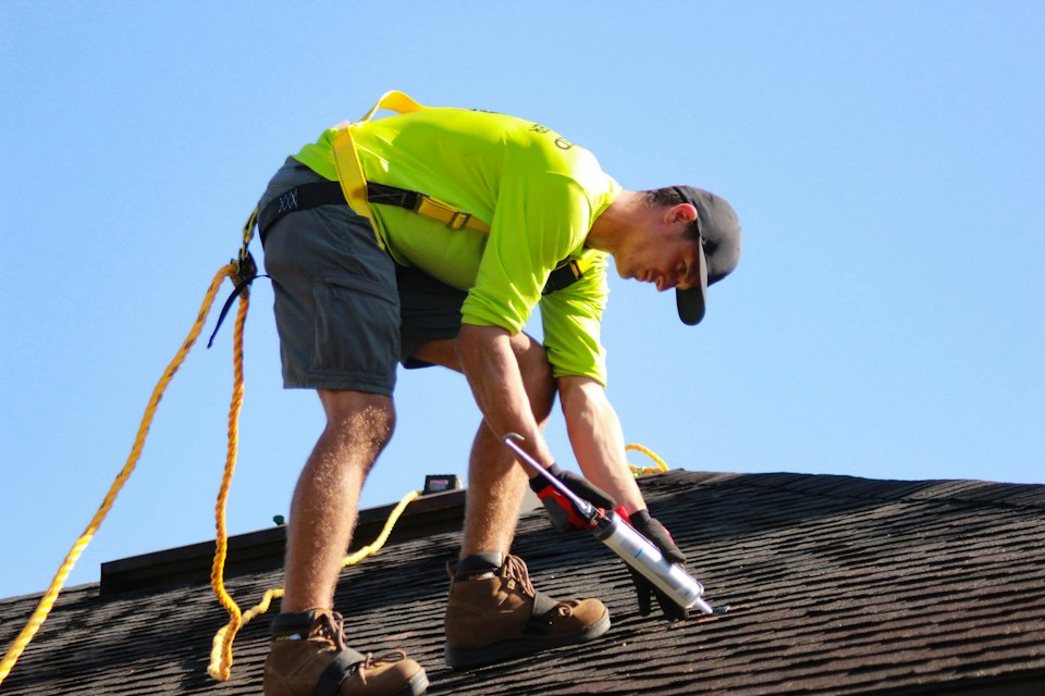 Technician carrying out roof repairs