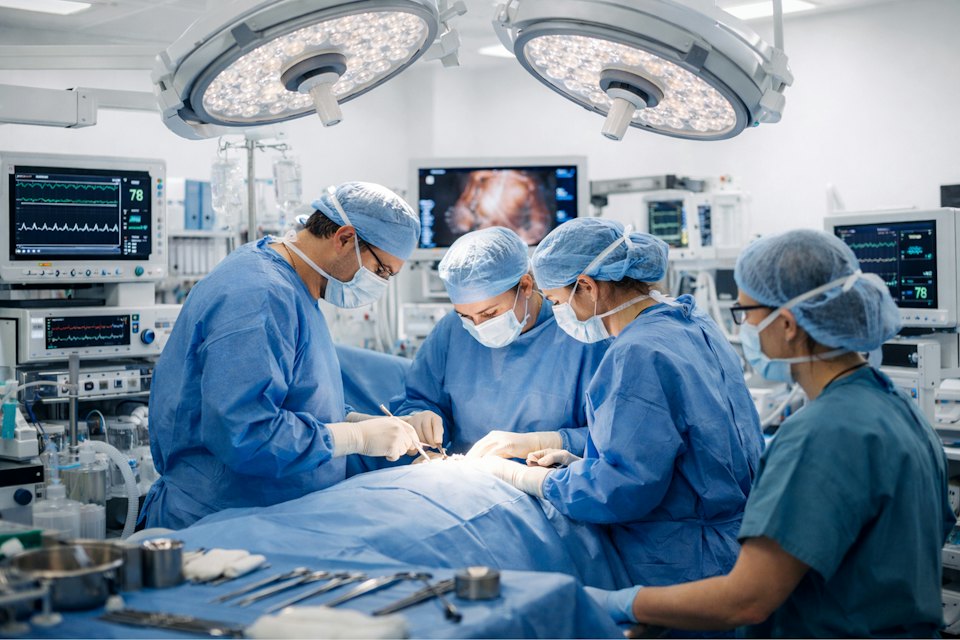 Surgical team working in a modern operating theatre