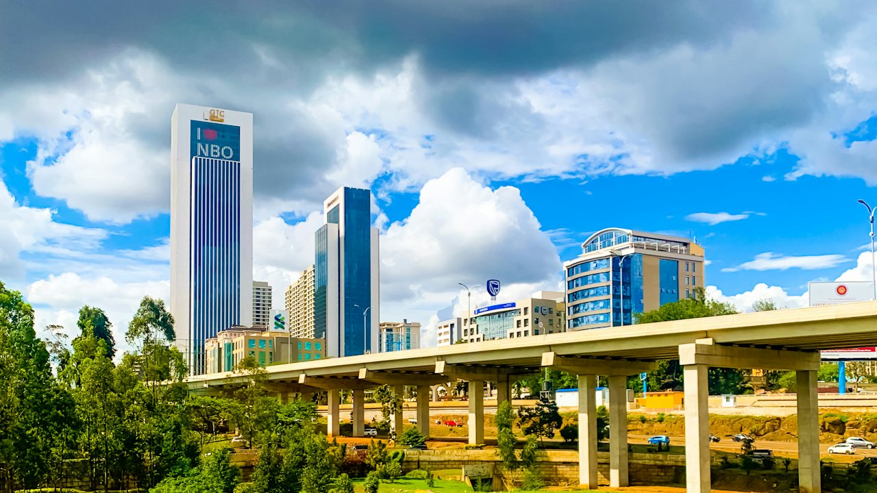 Nairobi's skyline and the Nairobi Expressway under a bright sky