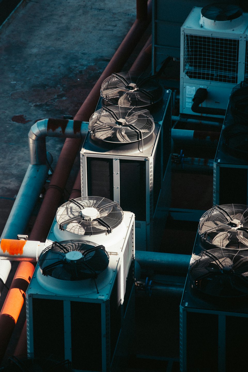 Rooftop air-conditioning condensers on a commercial building