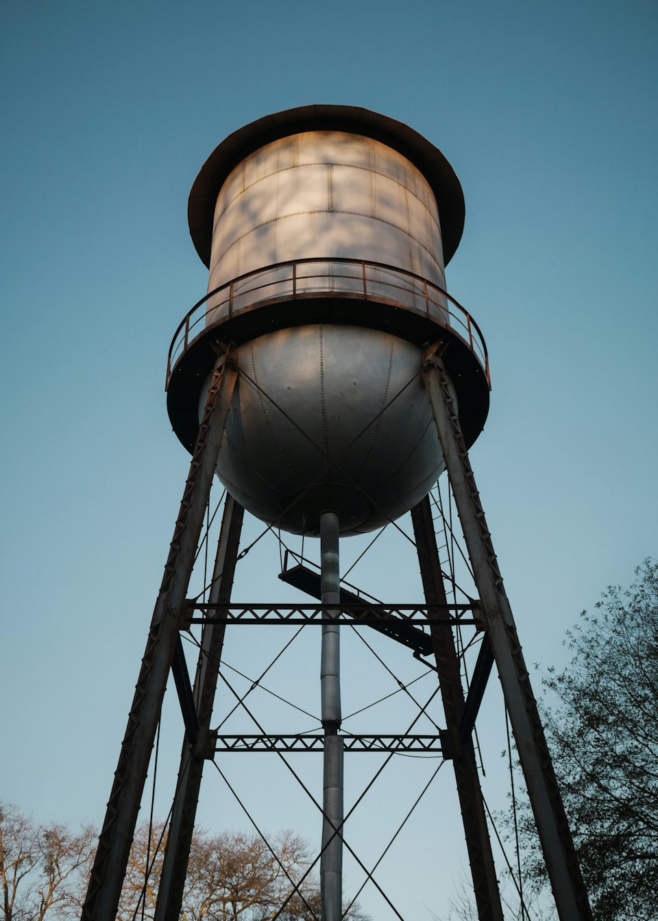 Elevated water storage tank against a blue sky